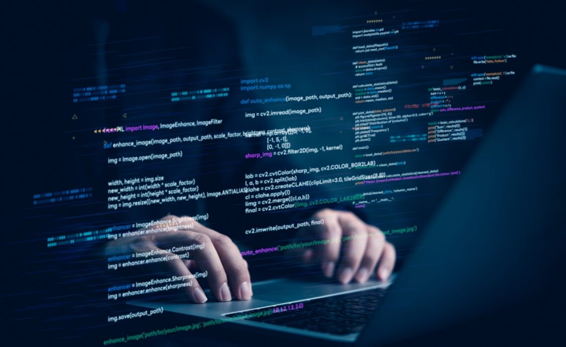 Hands,Typing,On,Laptop,With,Programming,Code,On,Screen,,Representing